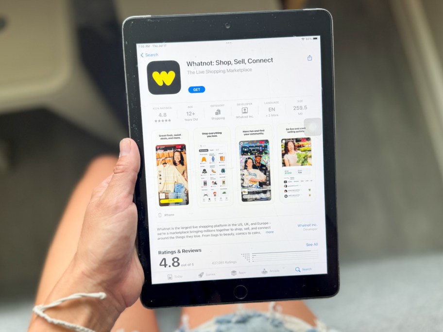 hand holding ipad showing whatnot
