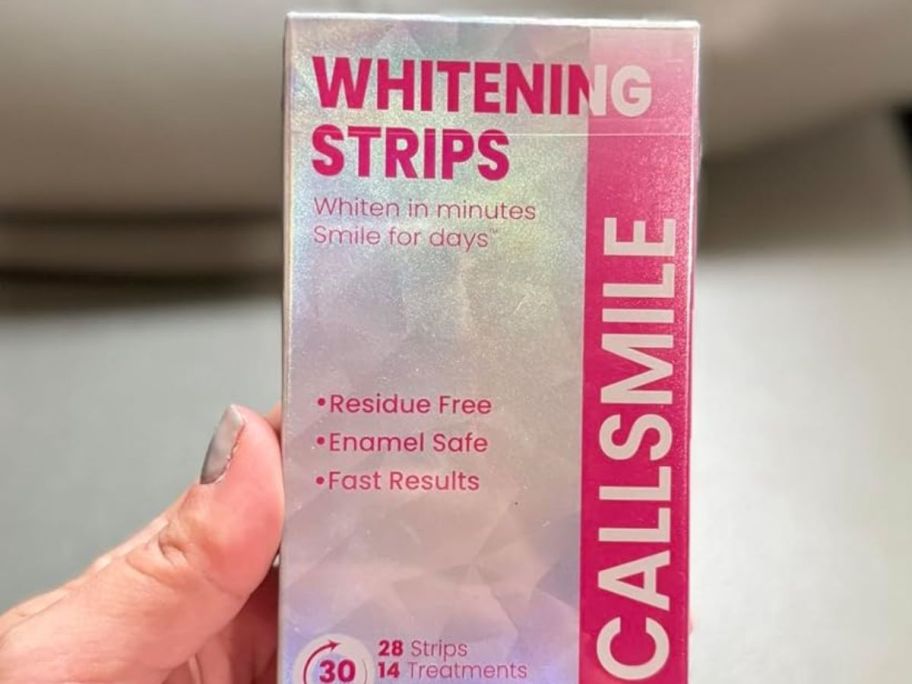 hand holding whitening strips 