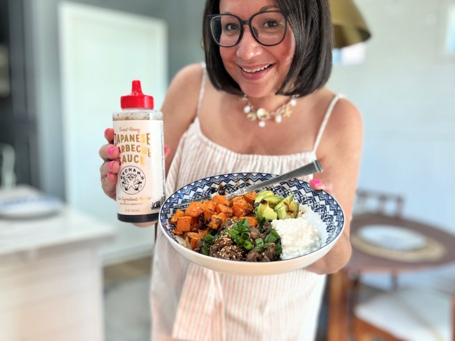 woman holding a bbq ground beef bowl with Bachan's Japanese bbq sauce