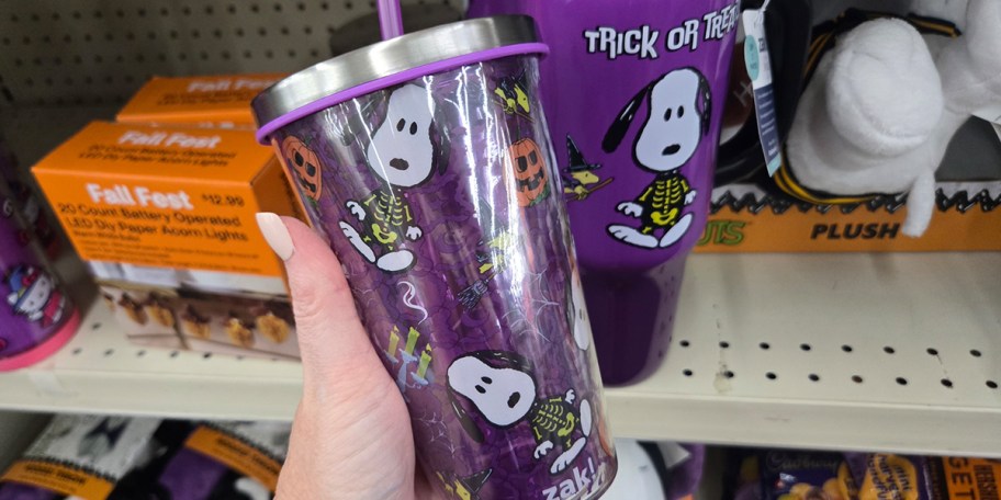 hand holding purple snoopy tumbler